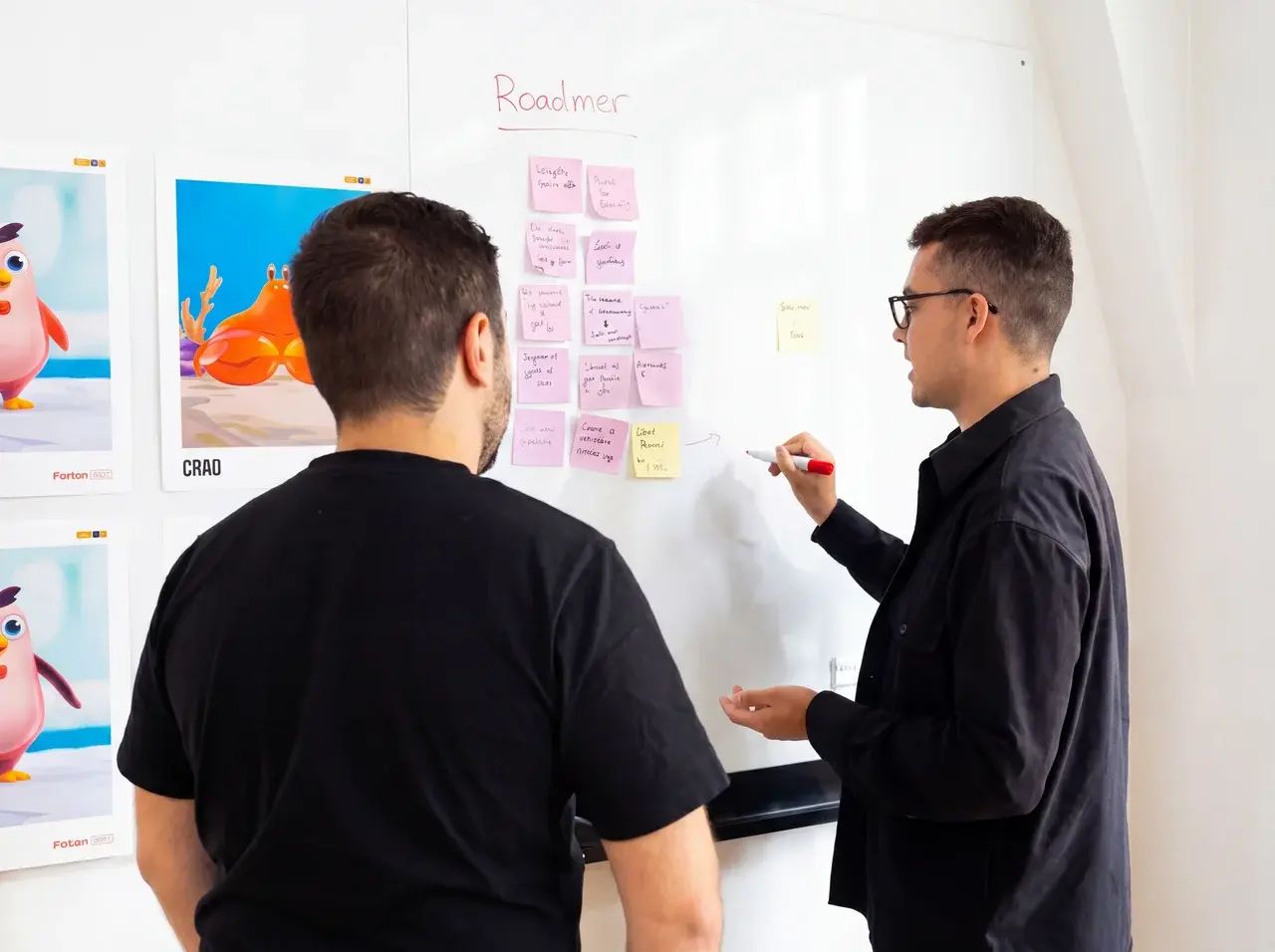 KaniE Concepts creative team reviewing brand character designs